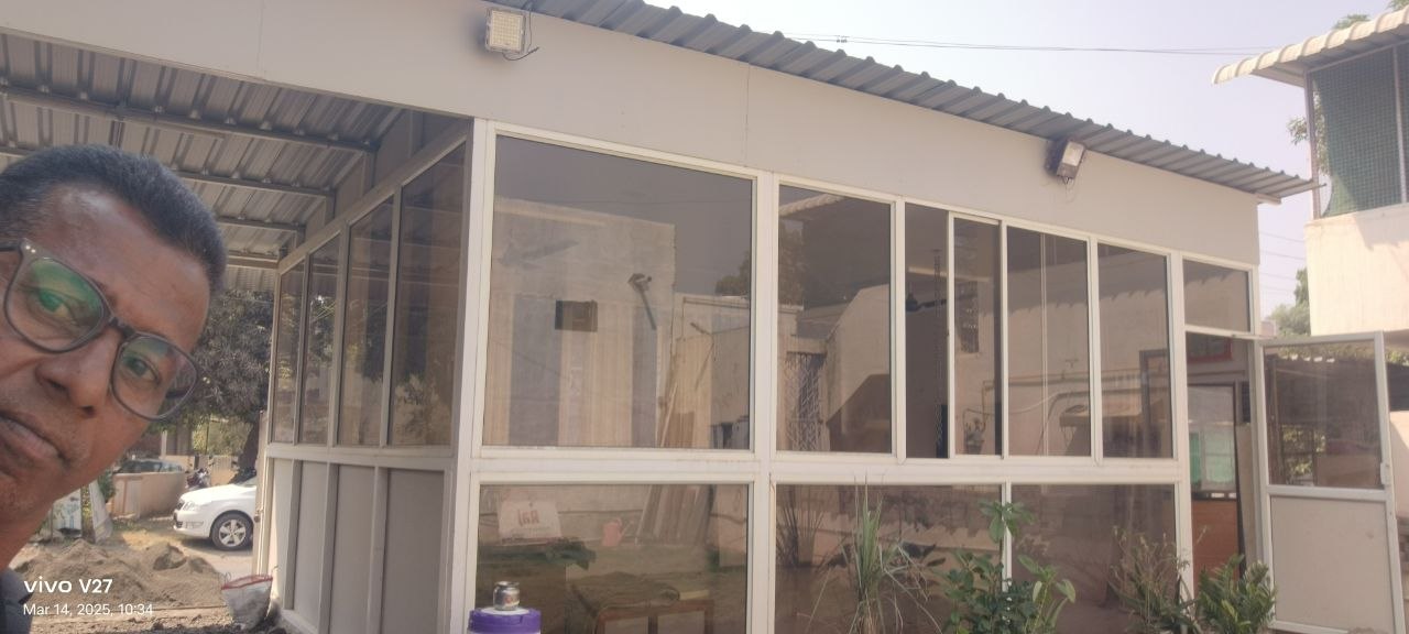 Glass and steel shed structure by Heritage Fabrication Solapur