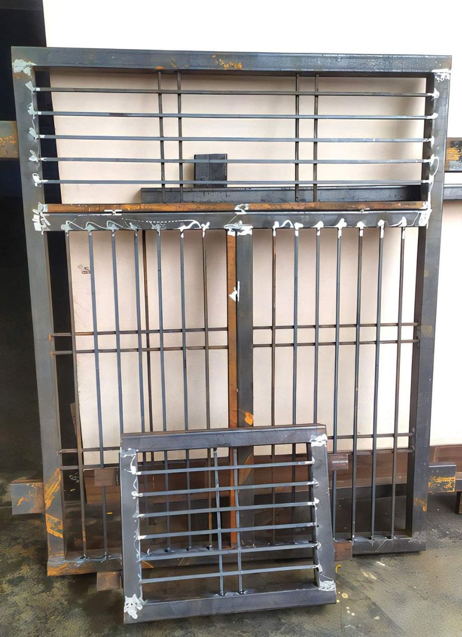 Custom window grill with safety bars by Heritage Fabrication Solapur